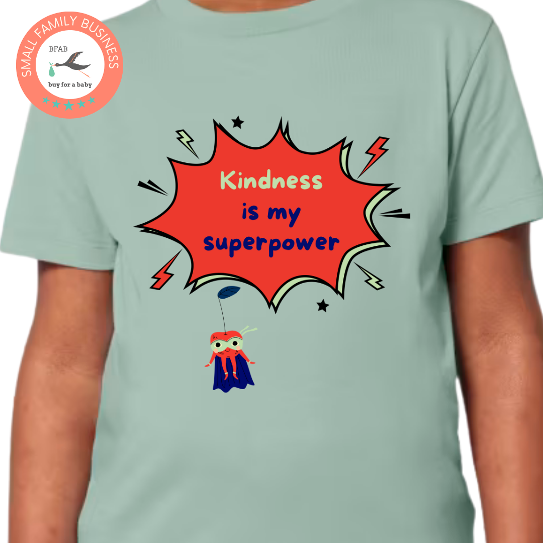 Close up of a sage green siblings t-shirt that says Kindness is my superpower